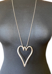 Long Matt silver necklace with hollow heart pendant